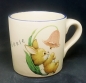 Preview: Keramik-Tasse  - Becher mit Wunschname – Motiv: Ostern – Hase mit Blume